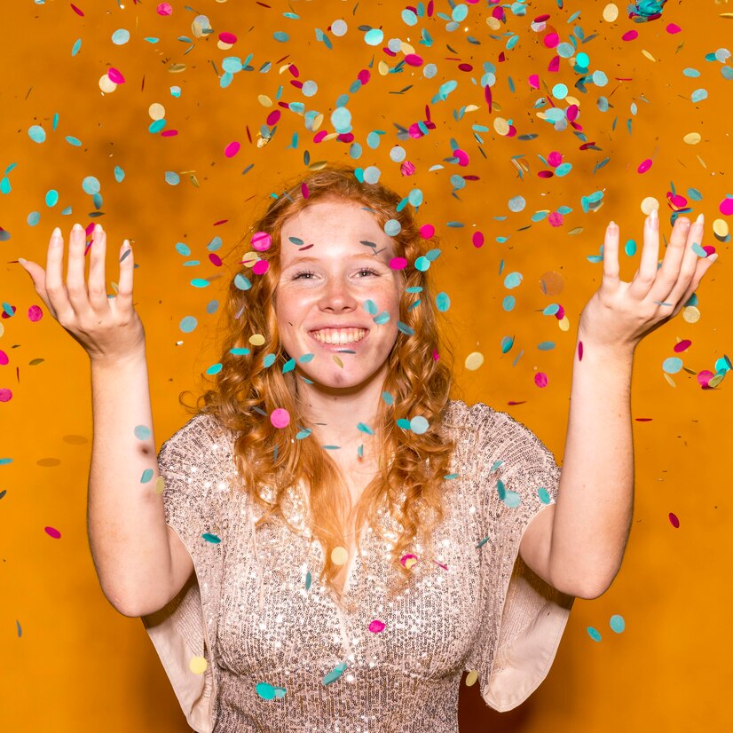 redhead-woman-throwing-colorful-confetti_23-2148793557 Happy redhead woman throwing colorful confetti during a Luxe Photobooth event in Ottawa